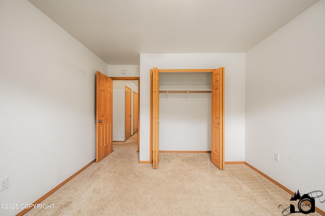 118 S Vickie Cir, Palmer, AK 99645 - unfurnished bedroom with light carpet, baseboards, and a closet
