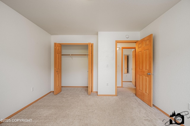 118 S Vickie Cir, Palmer, AK 99645 - unfurnished bedroom featuring light colored carpet, baseboards, and a closet