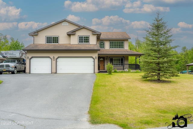 118 S Vickie Cir, Palmer, AK 99645 - traditional-style house with a garage, asphalt driveway, a front yard, and covered porch