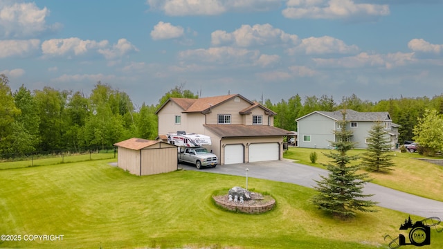 118 S Vickie Cir, Palmer, AK 99645 - view of front of property with asphalt driveway and an attached garage