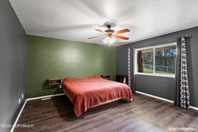 7490 W Rodney Cir, Wasilla, AK 99623 - bedroom featuring wood finished floors, baseboards, and ceiling fan