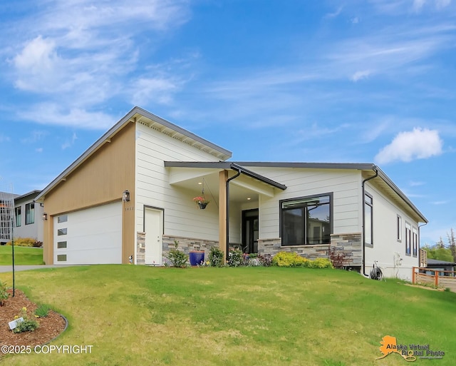 5466 Sandhill Loop, Anchorage, AK 99502 - view of front facade with a front lawn, an attached garage, and stone siding
