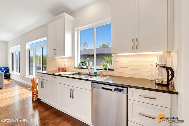5466 Sandhill Loop, Anchorage, AK 99502 - kitchen featuring dishwasher, a sink, dark countertops, and white cabinetry