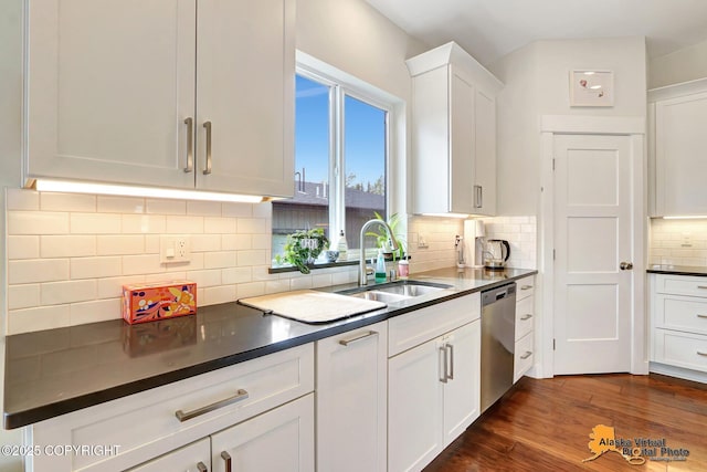 5466 Sandhill Loop, Anchorage, AK 99502 - kitchen with a sink, dishwasher, white cabinets, dark countertops, and decorative backsplash