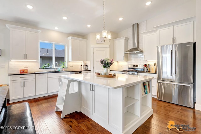 5466 Sandhill Loop, Anchorage, AK 99502 - kitchen with appliances with stainless steel finishes, wall chimney range hood, open shelves, white cabinets, and tasteful backsplash