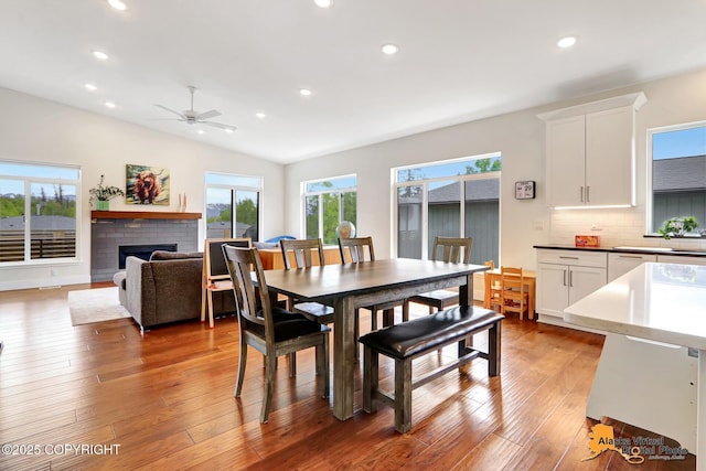 5466 Sandhill Loop, Anchorage, AK 99502 - dining room with plenty of natural light, hardwood / wood-style flooring, recessed lighting, a brick fireplace, and ceiling fan