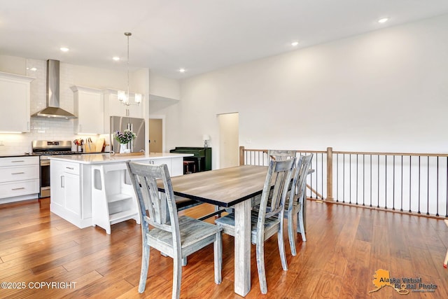 5466 Sandhill Loop, Anchorage, AK 99502 - dining room featuring hardwood / wood-style flooring and recessed lighting