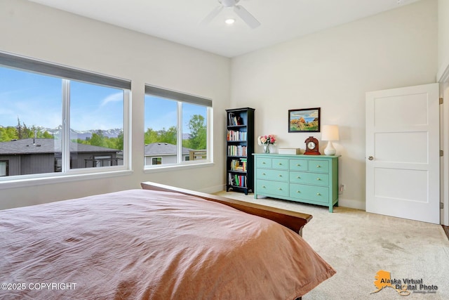 5466 Sandhill Loop, Anchorage, AK 99502 - carpeted bedroom featuring baseboards and ceiling fan