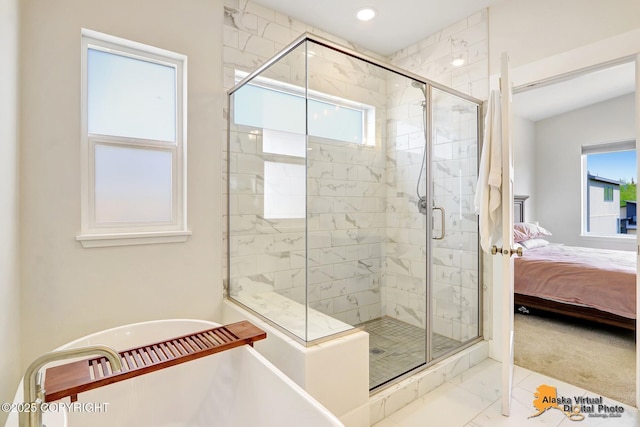 5466 Sandhill Loop, Anchorage, AK 99502 - ensuite bathroom featuring a soaking tub, healthy amount of natural light, a stall shower, marble finish flooring, and recessed lighting