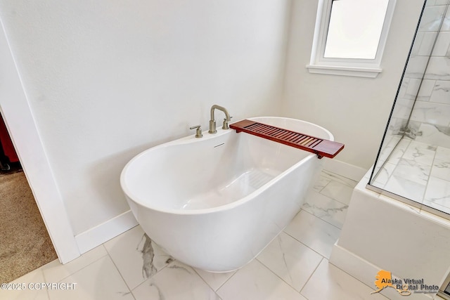 5466 Sandhill Loop, Anchorage, AK 99502 - full bath with baseboards, a freestanding bath, and marble look tile flooring
