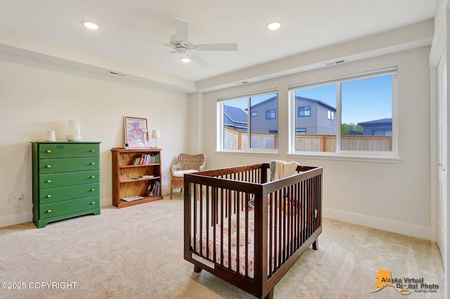 5466 Sandhill Loop, Anchorage, AK 99502 - carpeted bedroom with a crib, baseboards, recessed lighting, and a ceiling fan