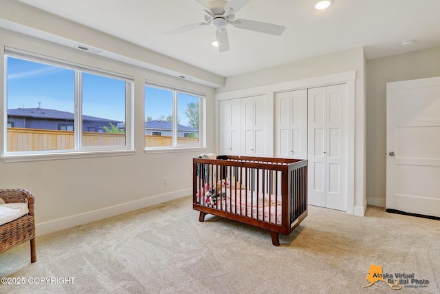 5466 Sandhill Loop, Anchorage, AK 99502 - bedroom with carpet flooring, baseboards, two closets, recessed lighting, and a ceiling fan