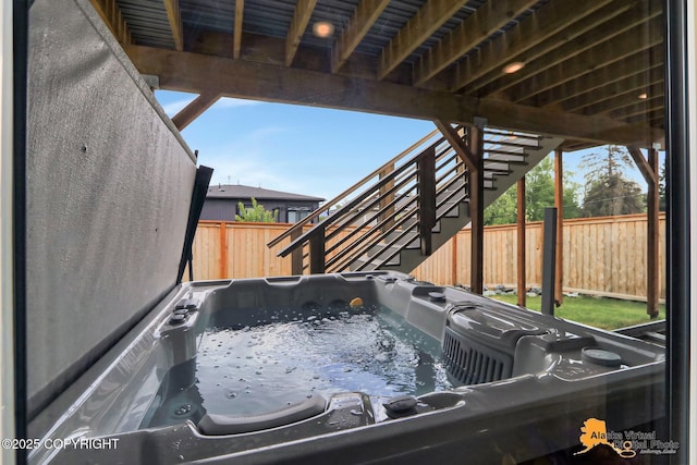 5466 Sandhill Loop, Anchorage, AK 99502 - exterior view of a fenced backyard and stairway