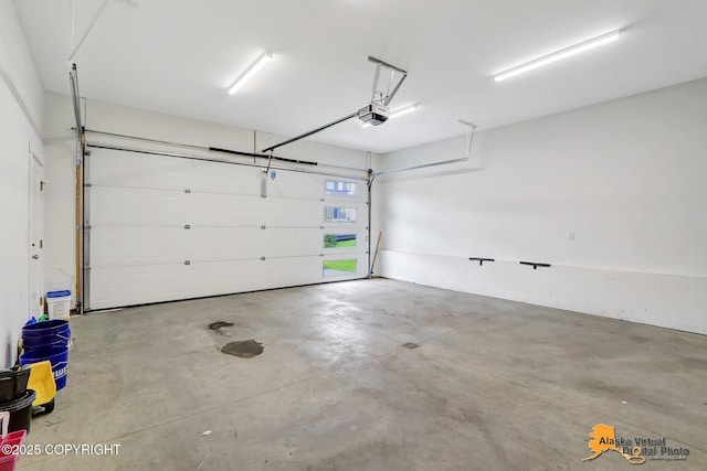 5466 Sandhill Loop, Anchorage, AK 99502 - garage featuring a garage door opener
