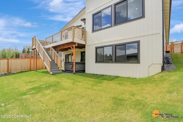5466 Sandhill Loop, Anchorage, AK 99502 - rear view of property with a wooden deck and stairway