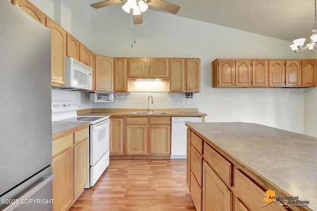 2598 Brookshire Loop # 27, Anchorage, AK 99504 - kitchen with white appliances, light brown cabinetry, vaulted ceiling, light wood-type flooring, and a ceiling fan