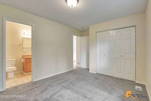 2598 Brookshire Loop # 27, Anchorage, AK 99504 - unfurnished bedroom with carpet floors, a closet, and connected bathroom