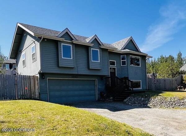 3940 E Cottonwood Way, Wasilla, AK 99654 - bi-level home featuring an attached garage and driveway