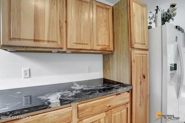 8825 W Mcquire Ln, Wasilla, AK 99623 - kitchen featuring white fridge with ice dispenser, light brown cabinets, and dark stone countertops