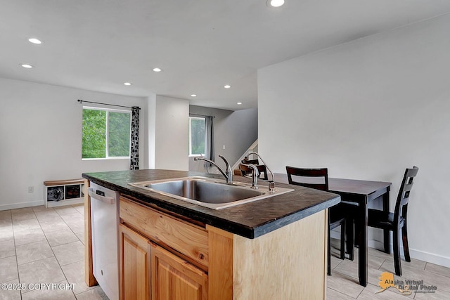 8825 W Mcquire Ln, Wasilla, AK 99623 - kitchen with dark countertops, dishwasher, recessed lighting, light brown cabinets, and a kitchen island with sink