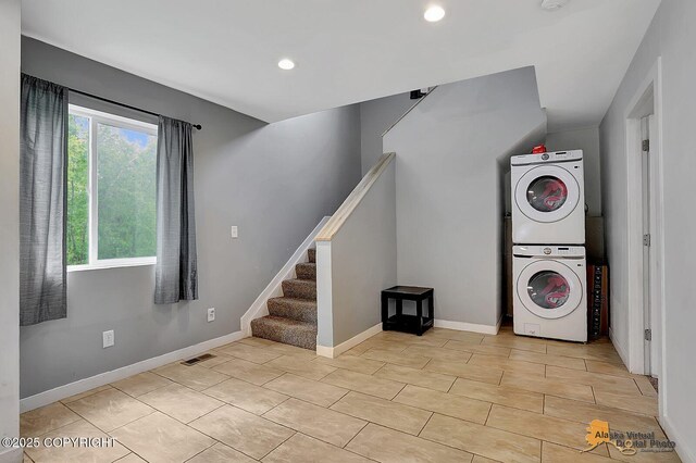 8825 W Mcquire Ln, Wasilla, AK 99623 - laundry room featuring stacked washer / drying machine and recessed lighting