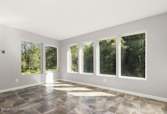 2551 La Honda Dr, Anchorage, AK 99517 - tiled spare room featuring baseboards