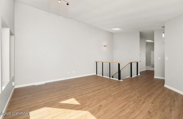 2551 La Honda Dr, Anchorage, AK 99517 - spare room with wood finished floors and baseboards