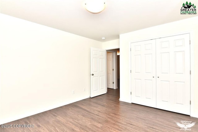 310 Park Way N, Pole, AK 99705 - unfurnished bedroom with wood finished floors and a closet