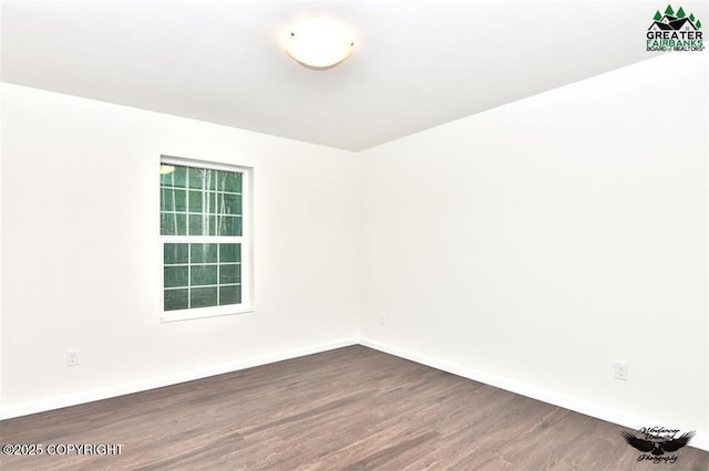 310 Park Way N, Pole, AK 99705 - unfurnished room featuring dark wood-style flooring and baseboards