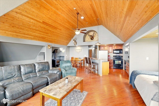 11091 Crestline Ln, Clam Gulch, AK 99568 - living area featuring wooden ceiling, high vaulted ceiling, light wood finished floors, and a ceiling fan