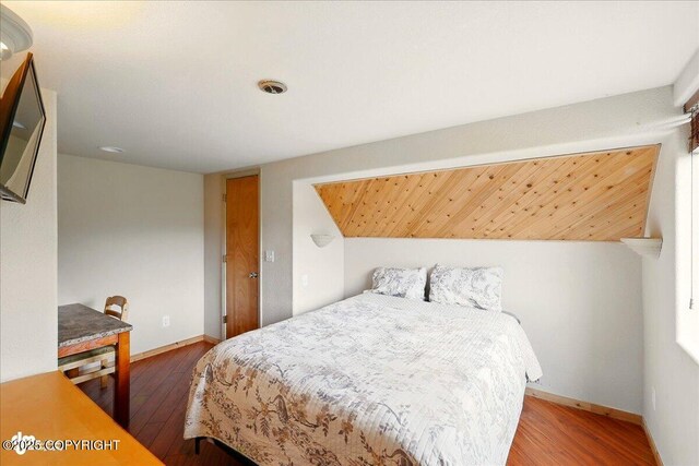 11091 Crestline Ln, Clam Gulch, AK 99568 - bedroom with wood finished floors and baseboards