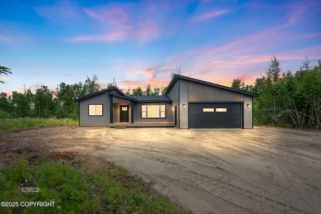 8328 S Ira Dr, Wasilla, AK 99623 - mid-century inspired home with dirt driveway and a garage