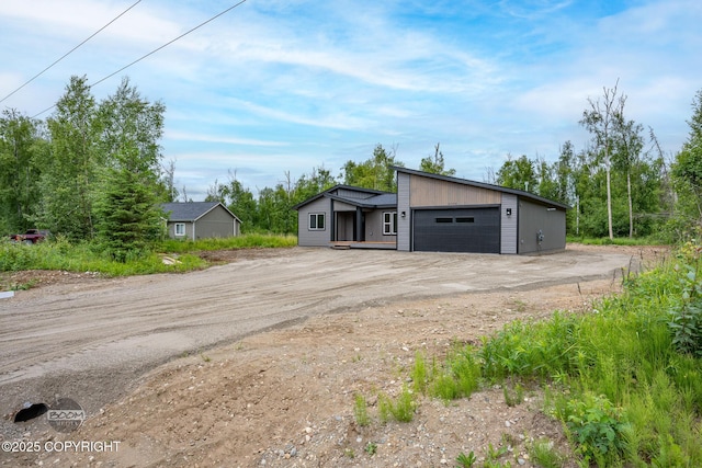 8328 S Ira Dr, Wasilla, AK 99623 - garage with dirt driveway