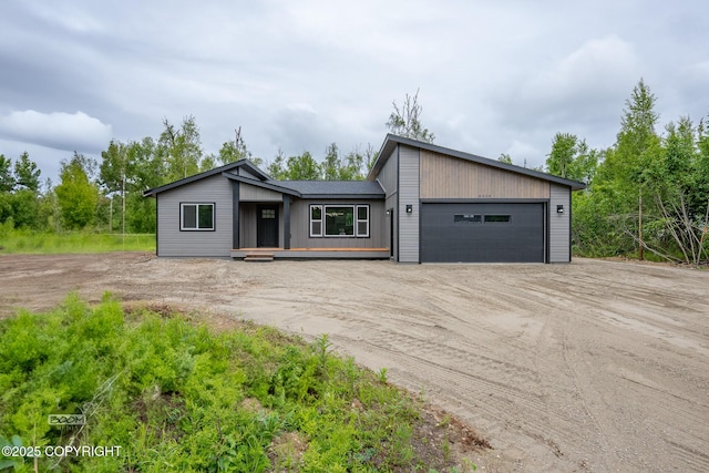 8328 S Ira Dr, Wasilla, AK 99623 - mid-century home featuring driveway and a garage