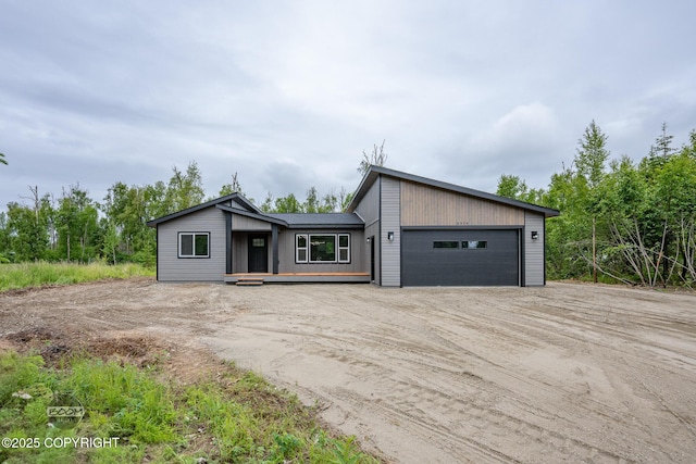 8328 S Ira Dr, Wasilla, AK 99623 - mid-century home featuring dirt driveway and a garage