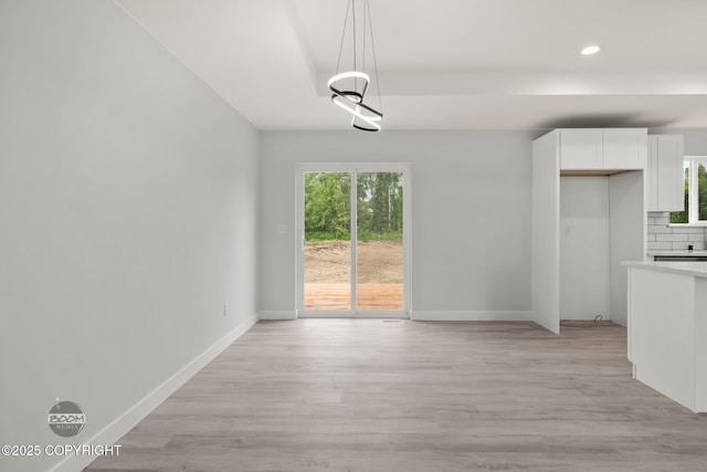 8328 S Ira Dr, Wasilla, AK 99623 - unfurnished dining area with recessed lighting, light wood-type flooring, and healthy amount of natural light