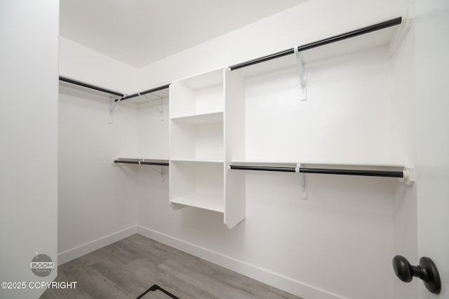 8328 S Ira Dr, Wasilla, AK 99623 - walk in closet featuring wood finished floors