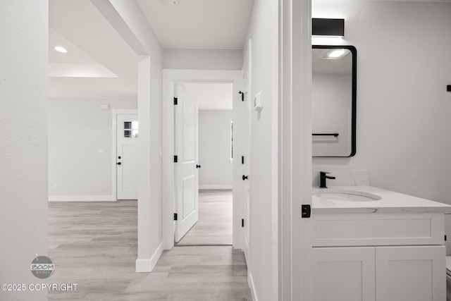 8328 S Ira Dr, Wasilla, AK 99623 - hall featuring light wood-type flooring and recessed lighting