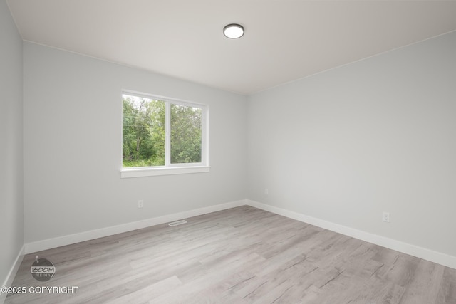 8328 S Ira Dr, Wasilla, AK 99623 - unfurnished room featuring wood finished floors and baseboards