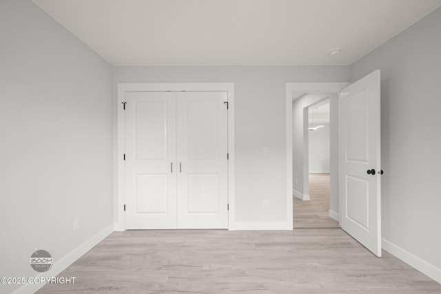 8328 S Ira Dr, Wasilla, AK 99623 - unfurnished bedroom featuring light wood-style floors and a closet