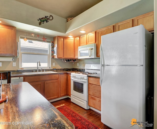 201 E Danna Ave Unit D, Wasilla, AK 99654 - kitchen featuring white appliances, a sink, dark countertops, dark wood-style flooring, and recessed lighting