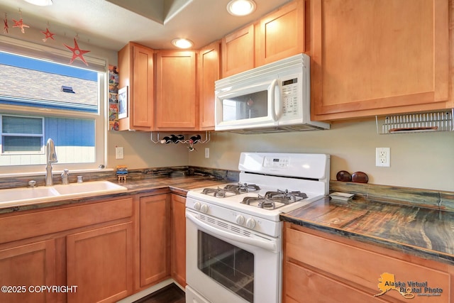 201 E Danna Ave Unit D, Wasilla, AK 99654 - kitchen with white appliances, a sink, dark countertops, and recessed lighting