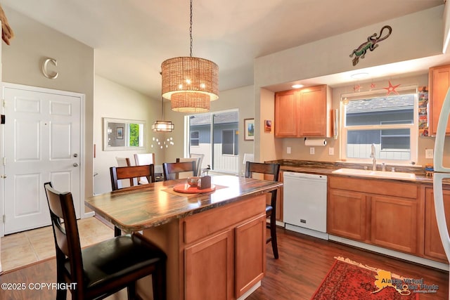 201 E Danna Ave Unit D, Wasilla, AK 99654 - kitchen featuring dishwasher, a sink, a kitchen bar, a chandelier, and healthy amount of natural light