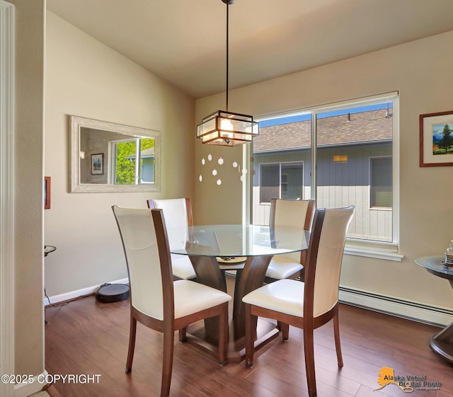 201 E Danna Ave Unit D, Wasilla, AK 99654 - dining area with baseboard heating, wood finished floors, a chandelier, and baseboards
