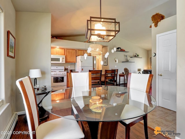 201 E Danna Ave Unit D, Wasilla, AK 99654 - dining space featuring vaulted ceiling, a baseboard radiator, and a chandelier