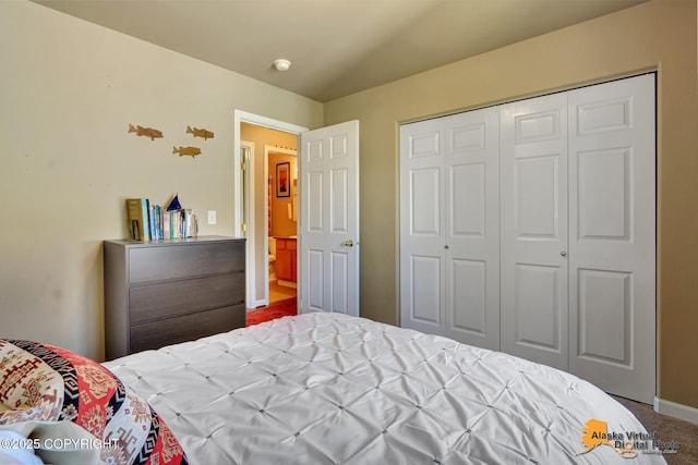 201 E Danna Ave Unit D, Wasilla, AK 99654 - carpeted bedroom featuring a closet and baseboards