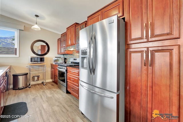 17132 Carl St, Anchorage, AK 99516 - kitchen featuring stainless steel appliances, brown cabinetry, under cabinet range hood, ornamental molding, and baseboards