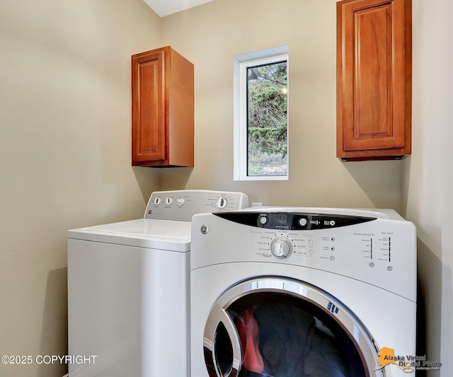 17132 Carl St, Anchorage, AK 99516 - laundry area featuring separate washer and dryer and cabinet space