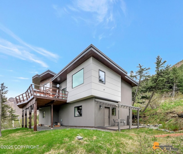 17132 Carl St, Anchorage, AK 99516 - rear view of property featuring a deck, a patio, and a yard