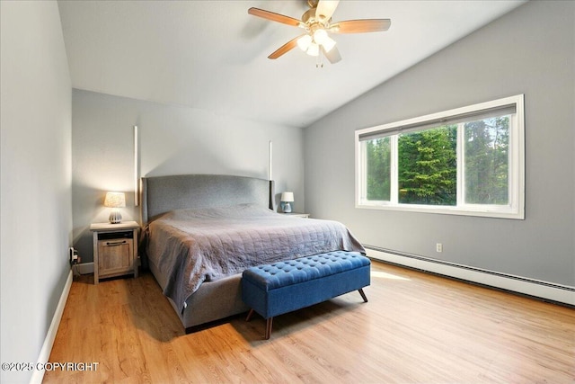 9701 Homestead Trl, Anchorage, AK 99507 - bedroom featuring vaulted ceiling, light wood finished floors, baseboards, a baseboard radiator, and ceiling fan